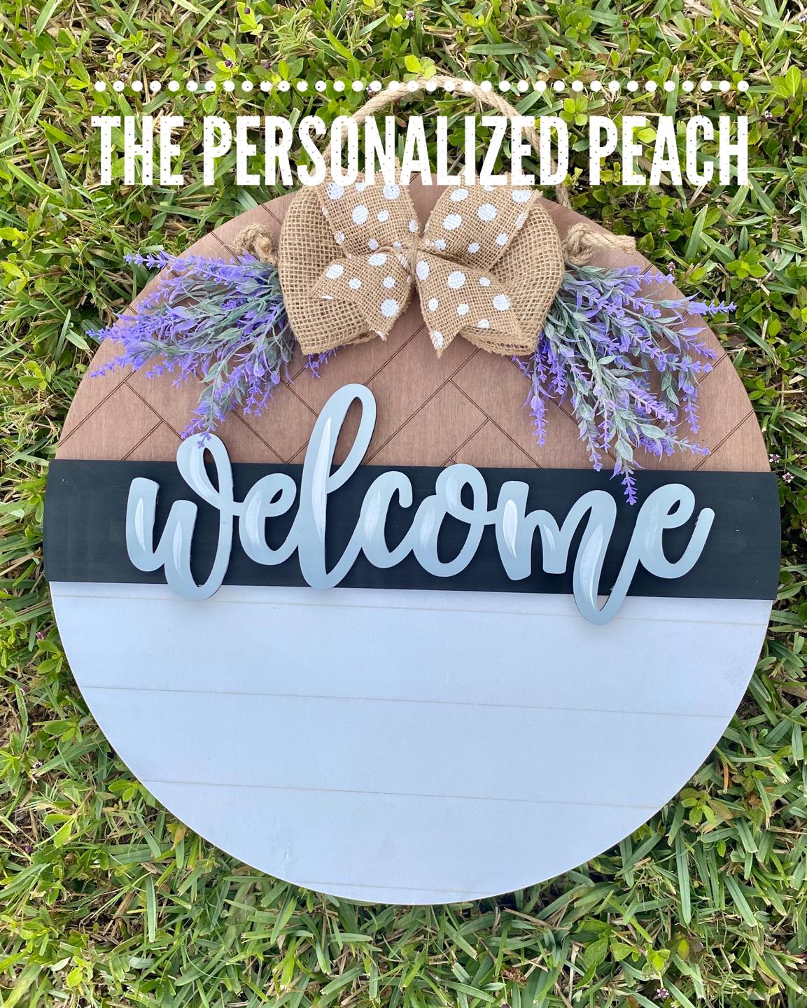 round welcome door hanger with faux lavender greenery, burlap ribbon, and wooden "welcome"